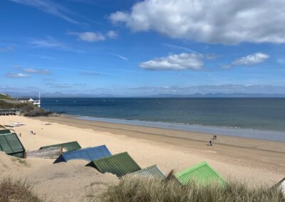 View of beach and sea near Pennant Igyn Holiday Cottage